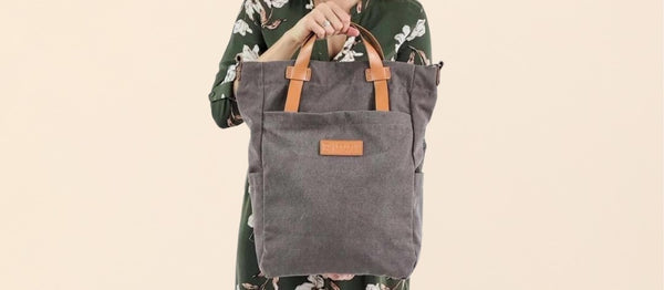 Woman holding a convertible bag - canvas bag