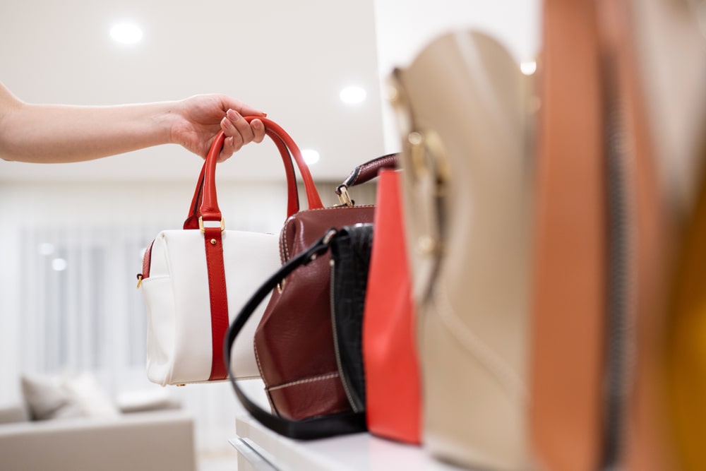 Woman arranging her bags - storage bag