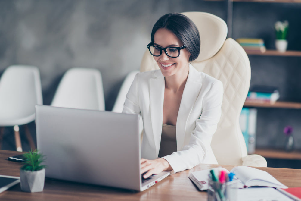 Image of a woman happily working